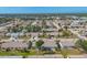 Wide aerial view of Foxwood community, showing a variety of homes and streets at 610 Apple Ln, Englewood, FL 34223
