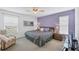Spacious bedroom with king-size bed and calming decor at 610 Apple Ln, Englewood, FL 34223