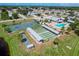 Aerial view showing tennis, shuffleboard, and bocce ball courts at 610 Apple Ln, Englewood, FL 34223