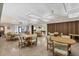Community room with tables, chairs, and a pool table at 610 Apple Ln, Englewood, FL 34223