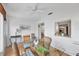 Dining area with glass-top table and view into kitchen at 610 Apple Ln, Englewood, FL 34223