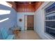 Inviting front entry with tiled floor, and small table with chairs at 610 Apple Ln, Englewood, FL 34223
