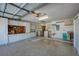 Garage with cabinets, workbench, and laundry hookups at 610 Apple Ln, Englewood, FL 34223