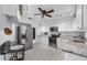 Modern kitchen with white cabinets, granite countertops, and stainless steel appliances at 610 Apple Ln, Englewood, FL 34223