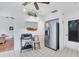 Modern kitchen with white cabinets, stainless steel appliances, and wine rack at 610 Apple Ln, Englewood, FL 34223