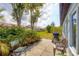 Cozy backyard patio with grill and seating, ideal for outdoor dining at 610 Apple Ln, Englewood, FL 34223