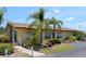 Community building with palm trees and parking at 6699 San Casa Dr # S1, Englewood, FL 34224
