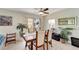 Bright dining area with a wooden table and four chairs at 6699 San Casa Dr # S1, Englewood, FL 34224