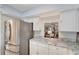 Modern kitchen features stainless steel appliances and granite countertops at 6699 San Casa Dr # S1, Englewood, FL 34224