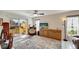 Bright living room with sliding glass doors leading to patio at 6699 San Casa Dr # S1, Englewood, FL 34224
