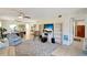Spacious living area with built-in shelving and hardwood floors at 6699 San Casa Dr # S1, Englewood, FL 34224