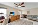 Bright living room with ceiling fan and comfortable seating at 6699 San Casa Dr # S1, Englewood, FL 34224