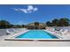Inviting community pool with lounge chairs at 6699 San Casa Dr # S1, Englewood, FL 34224