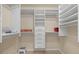 Large walk-in closet with ample shelving and hanging space at 7 Golf View Dr # 60, Englewood, FL 34223