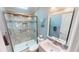 Clean bathroom, featuring a walk-in shower and updated fixtures at 808 Tangerine Woods Blvd, Englewood, FL 34223