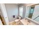 Updated bathroom with gray vanity, a toilet and a walk in shower at 808 Tangerine Woods Blvd, Englewood, FL 34223