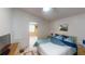 Bright bedroom with a queen-size bed and built-in shelving at 808 Tangerine Woods Blvd, Englewood, FL 34223