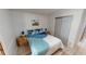 Bedroom with double bed, nightstands, and a sliding door closet at 808 Tangerine Woods Blvd, Englewood, FL 34223