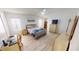 Spacious bedroom with light wood floors, ample closet space, and a ceiling fan at 808 Tangerine Woods Blvd, Englewood, FL 34223