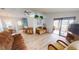 Open living area with access to sunroom and dining area at 808 Tangerine Woods Blvd, Englewood, FL 34223