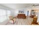 Living room boasts a recliner sofa and light flooring at 808 Tangerine Woods Blvd, Englewood, FL 34223
