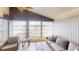 Relaxing sunroom with comfy seating and plenty of natural light at 808 Tangerine Woods Blvd, Englewood, FL 34223