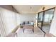 Sunroom with comfortable seating, creating a relaxing space at 808 Tangerine Woods Blvd, Englewood, FL 34223