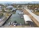 Aerial view of canal with many boats and docks at 8164 Robert St, Englewood, FL 34224