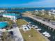 Aerial view of waterfront property with boat slips and resort amenities at 8226 Harborside Cir, Englewood, FL 34224