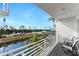 Balcony overlooking the canal with seating for two at 8226 Harborside Cir, Englewood, FL 34224