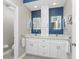 Modern bathroom with double vanity, and lots of storage at 8226 Harborside Cir, Englewood, FL 34224