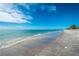 Scenic beachfront property with a tranquil shoreline and clear water at 8226 Harborside Cir, Englewood, FL 34224