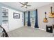 Bedroom with a murphy bed and ceiling fan at 8226 Harborside Cir, Englewood, FL 34224