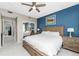 Spacious Primary bedroom with a king-size bed and private access to balcony at 8226 Harborside Cir, Englewood, FL 34224