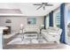 Spacious living room with comfy seating, large windows and hardwood floors at 8226 Harborside Cir, Englewood, FL 34224