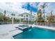 Community pool and spa with waterfall feature at 8226 Harborside Cir, Englewood, FL 34224