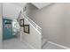 Modern staircase with simple design and neutral color palette at 8226 Harborside Cir, Englewood, FL 34224