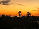 Stunning sunset view over the water, showcasing the property's waterfront location at 8226 Harborside Cir, Englewood, FL 34224
