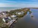 Aerial perspective of coastal homes, showcasing ocean and river views at 8245 Manasota Key Rd, Englewood, FL 34223