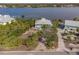 Aerial view of waterfront home with private dock and access at 8245 Manasota Key Rd, Englewood, FL 34223