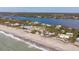 Aerial view of beachfront community with ocean and river views at 8245 Manasota Key Rd, Englewood, FL 34223