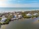 Aerial view of beachfront homes showcasing ocean and waterway access at 8245 Manasota Key Rd, Englewood, FL 34223