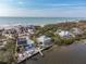 Aerial view of a waterfront house with private dock and ocean access at 8245 Manasota Key Rd, Englewood, FL 34223