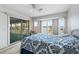 Bedroom with water views and access to a deck at 8245 Manasota Key Rd, Englewood, FL 34223