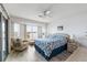 Main bedroom with water views and a sitting area at 8245 Manasota Key Rd, Englewood, FL 34223