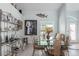 Bright dining room featuring a glass table and unique wall art at 8245 Manasota Key Rd, Englewood, FL 34223