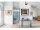 Light and airy entryway with glass-top console table at 8245 Manasota Key Rd, Englewood, FL 34223