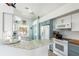 Modern kitchen with light blue cabinets and stainless steel appliances at 8245 Manasota Key Rd, Englewood, FL 34223