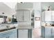 Bright kitchen with light blue cabinets and granite countertops at 8245 Manasota Key Rd, Englewood, FL 34223
