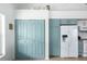 Convenient laundry room with washer and dryer, located in a kitchen pantry at 8245 Manasota Key Rd, Englewood, FL 34223